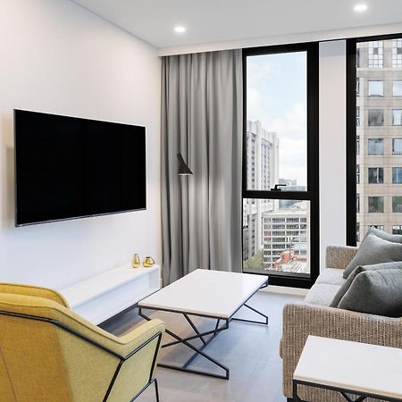Meriton Suites Μελβούρνη Εξωτερικό φωτογραφία A living room